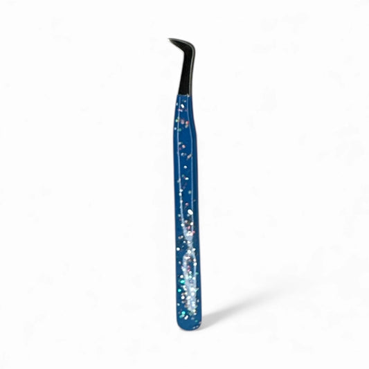 Blue tweezers by Lash Better, with a starry design on a white background