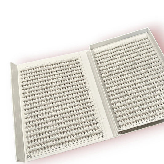 Two open boxes containing rows of premade Lash Better brand lash extensions on a white background