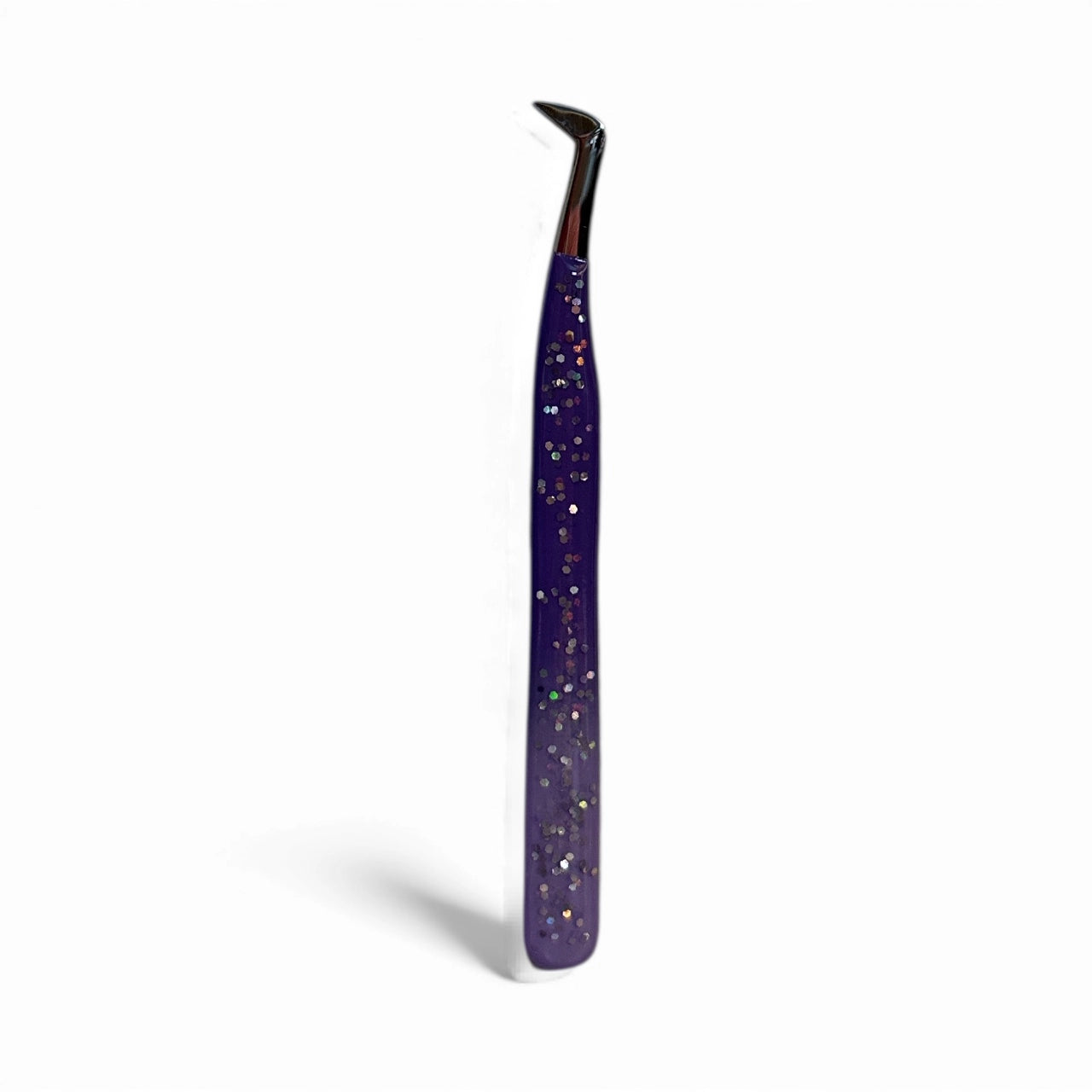 Purple tweezers with glittery finish on a white background
