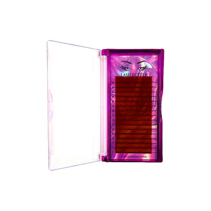 Red colored eyelash extensions in a purple case on a white background