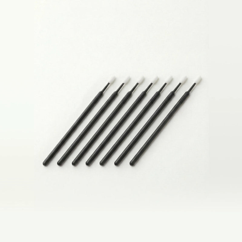 Set of black microswabs on a white background