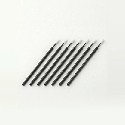 Set of black microswabs on a white background