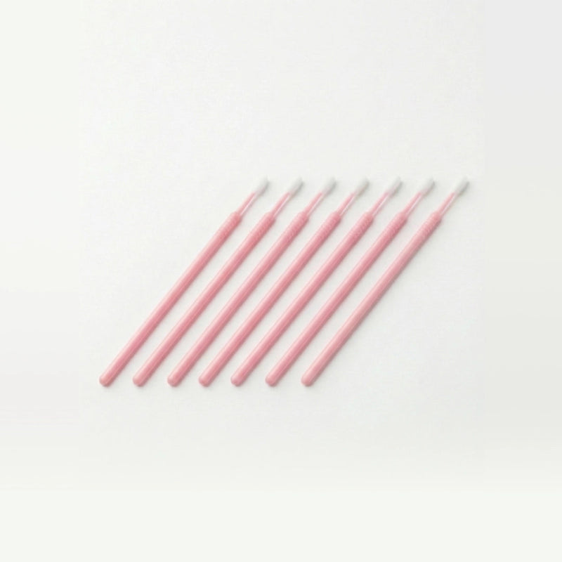 Set of pink microswabs on a white background