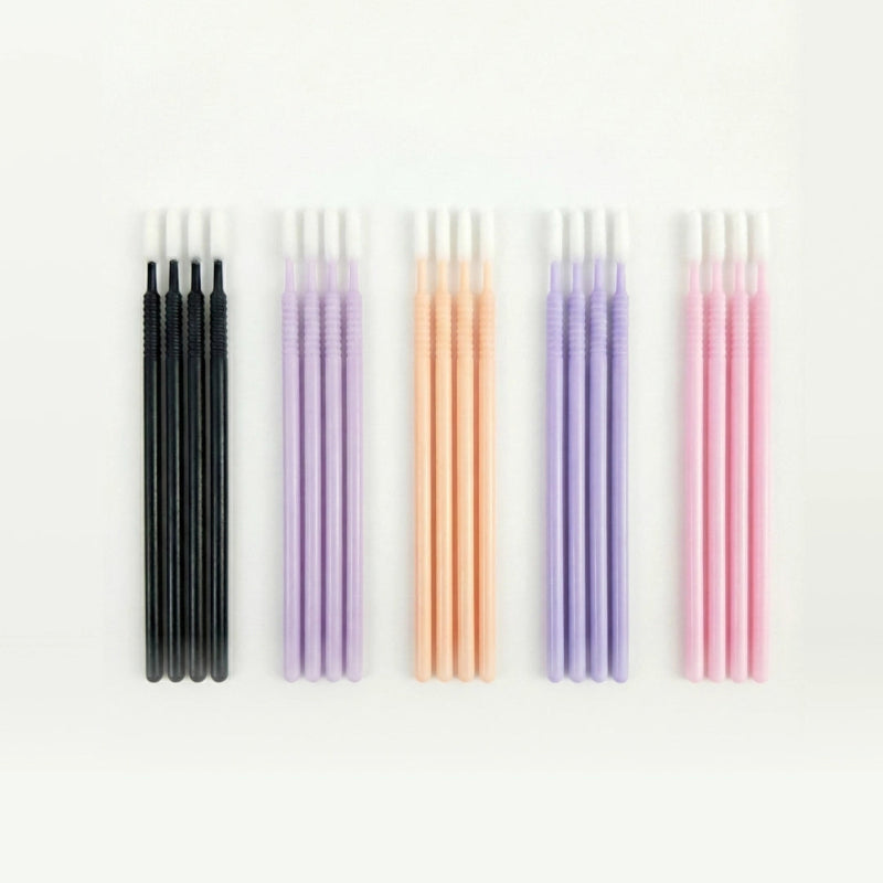 Set of microswabs in various colors on a white background