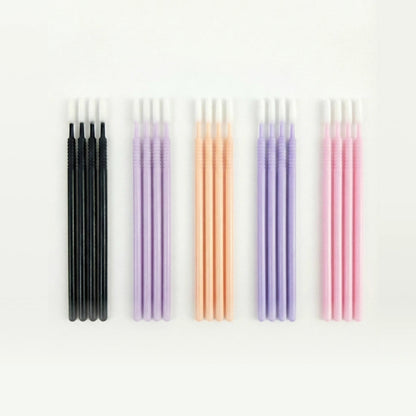 Set of microswabs in various colors on a white background