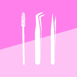 White makeup tools on a pink background